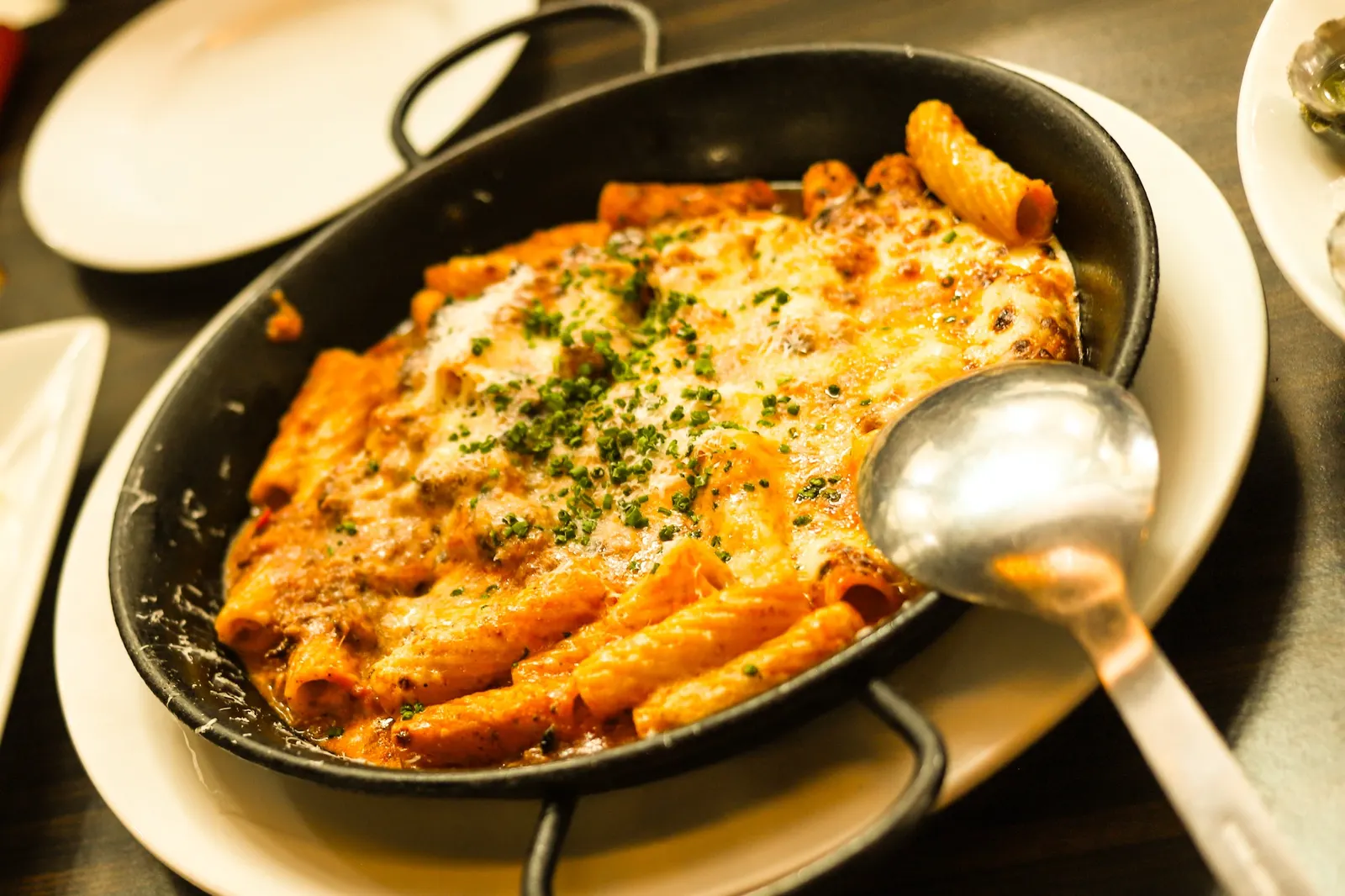 Baked pasta in a skillet at NUNO’S